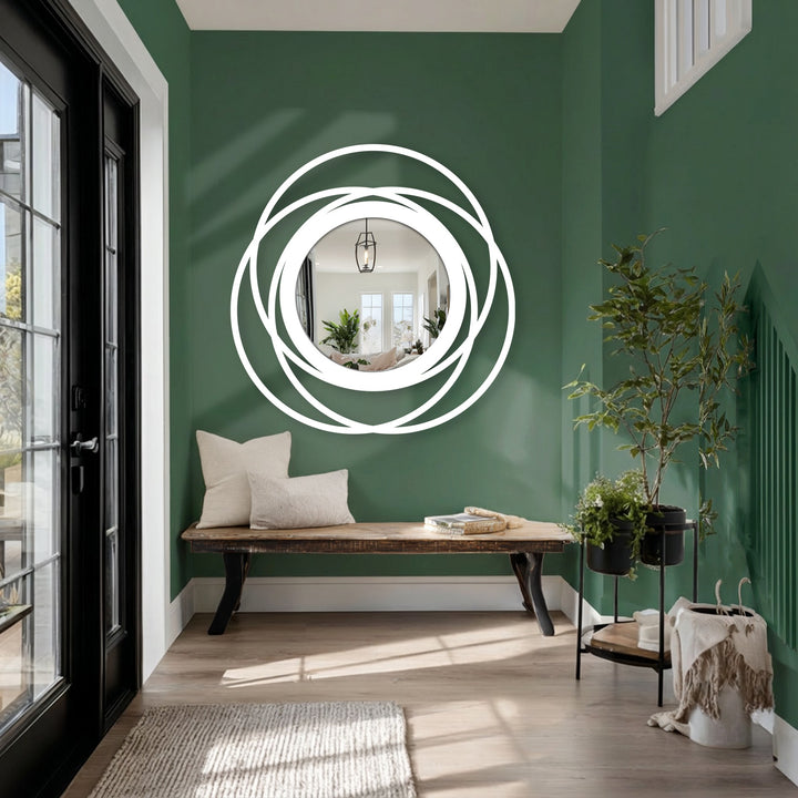 Negative space highlights the intertwined circles of this modern floor mirror, a bold design that elevates decorating with wall mirrors through a striking silhouette.