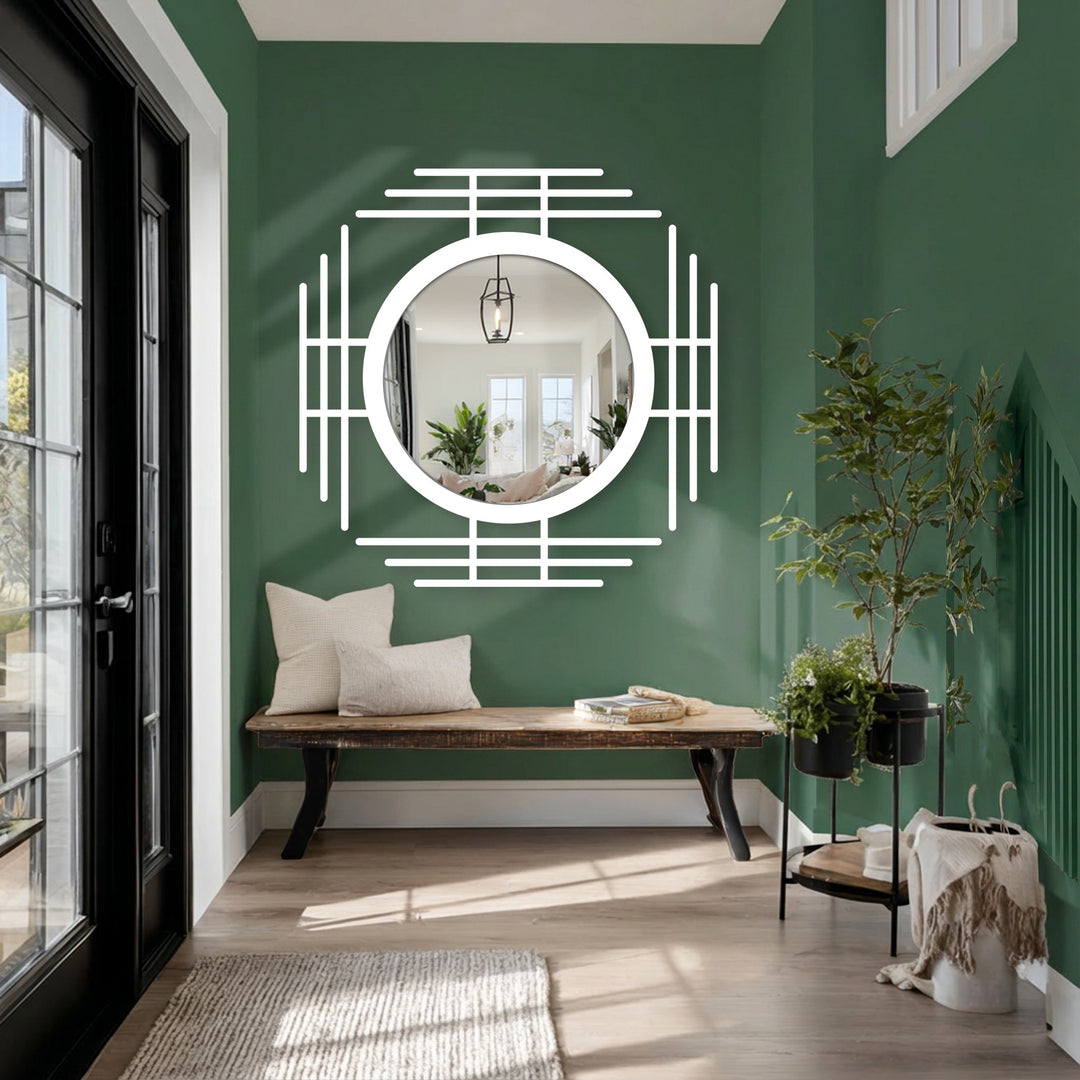 Contrasting the green wall is a white geometric line circle mirror, providing a decorative metal art focal point in the room's interior.