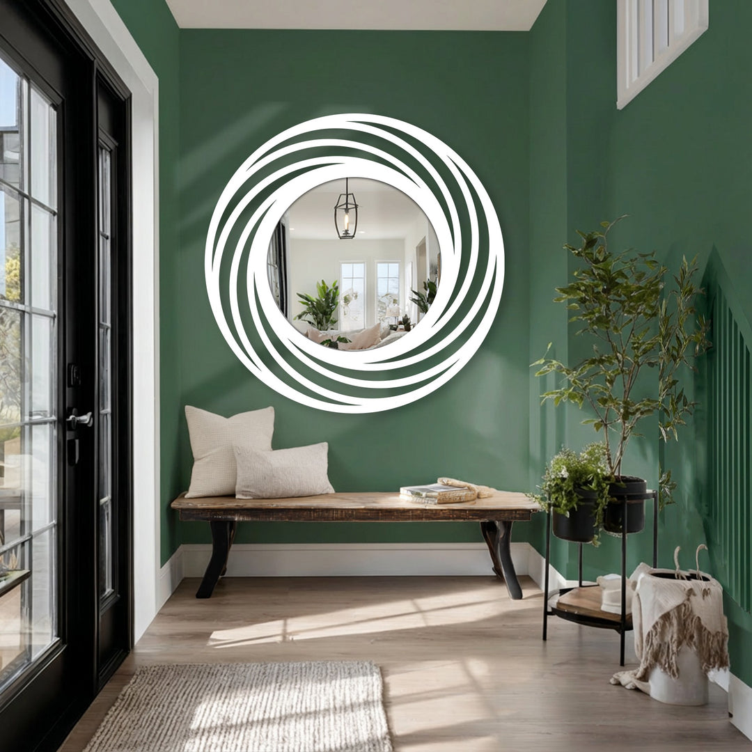 Geometric swirling rings define this circle floor mirror, a modern home decoration showcasing layered curves in black metal around a reflective center.