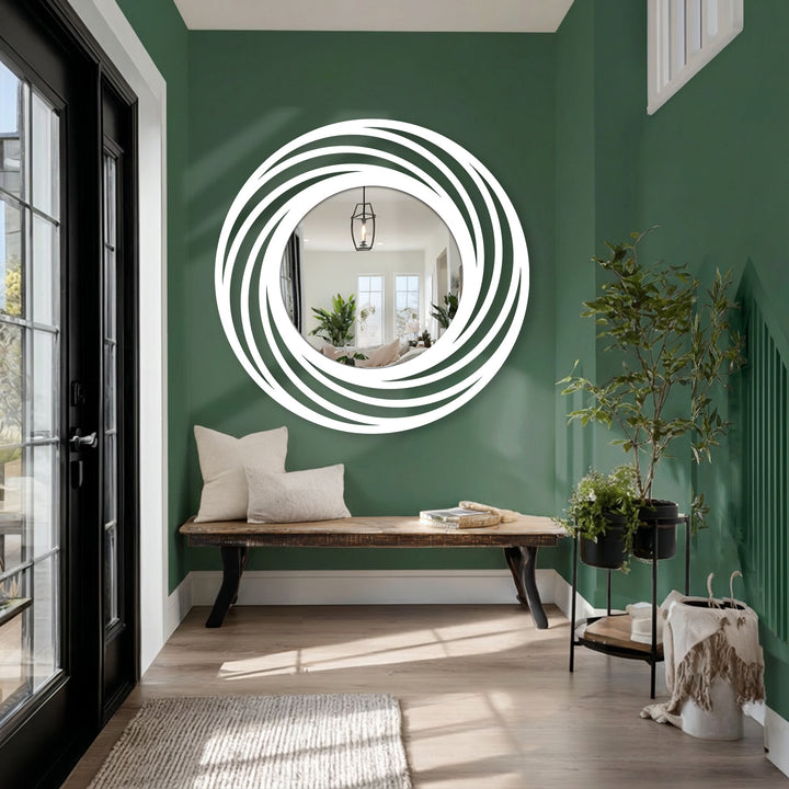 Geometric swirling rings define this circle floor mirror, a modern home decoration showcasing layered curves in black metal around a reflective center.