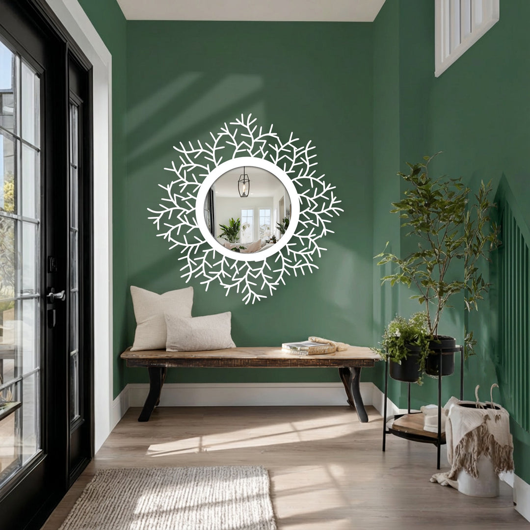 Foreground shows a botanical halo floor mirror, showcasing black metal leaves framing a round looking glass, a decoration wall art.