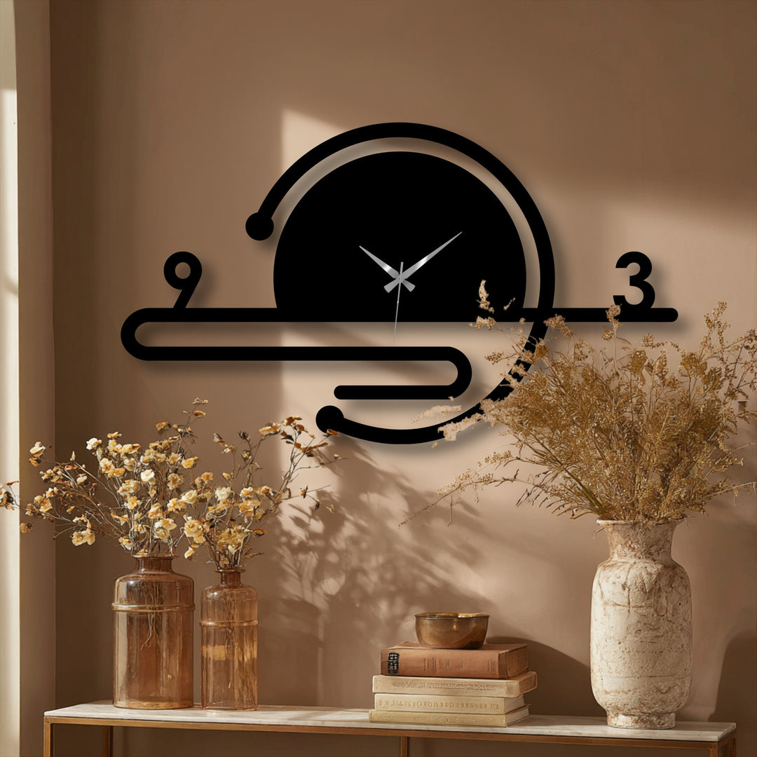 Illuminated by a sunlit window, the minimalist orbit line metal wall clock presents a striking example of metal art for wall, displaying a modern geometric design.