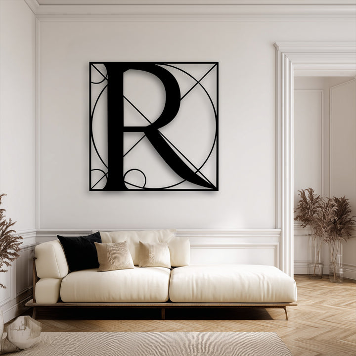 This unique metal wall art exhibits precision-cut craftsmanship, highlighting the sleek black finish of the geometric letter R design.