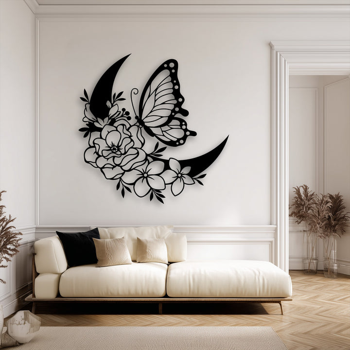The distinct color transition from the unique metal wall art's deep black butterfly and floral crescent creates striking contrast on the light wall.