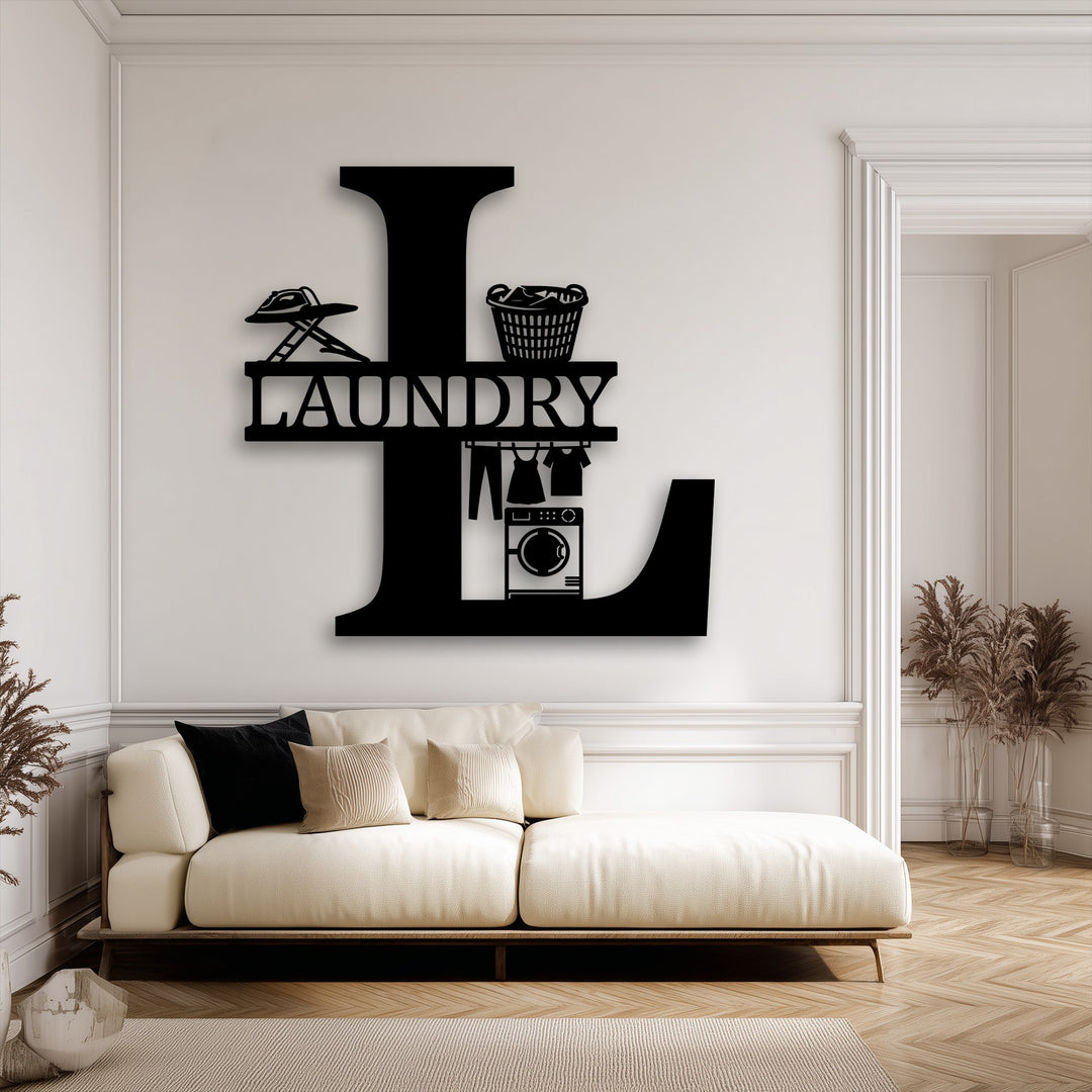 The foreground showcases a cream sofa with decorative pillows and a soft rug, complementing the personalized laundry room monogram metal wall decor.