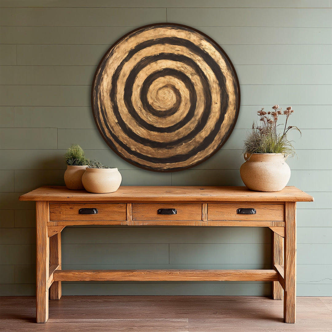 Showcasing the realistic detail, this round wooden golden ripple oil painting reproduction print wall art features textured concentric rings in black and gold tones.