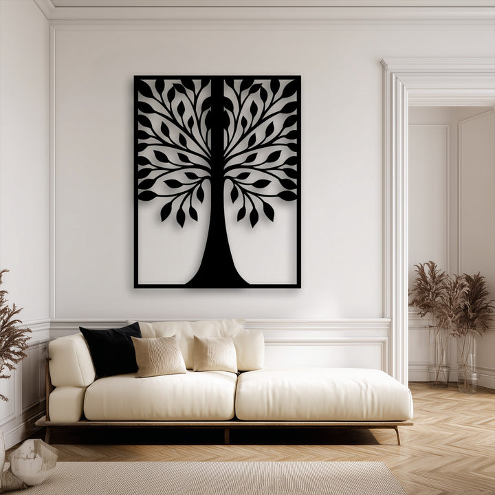 A large, vertically oriented rectangular metal wall decor piece showcases a striking symmetrical leaf tree silhouette.