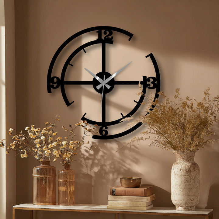 Juxtaposing the sharp lines of the geometric metal wall clock against the organic forms of dried floral arrangements highlights this decorative metal art.