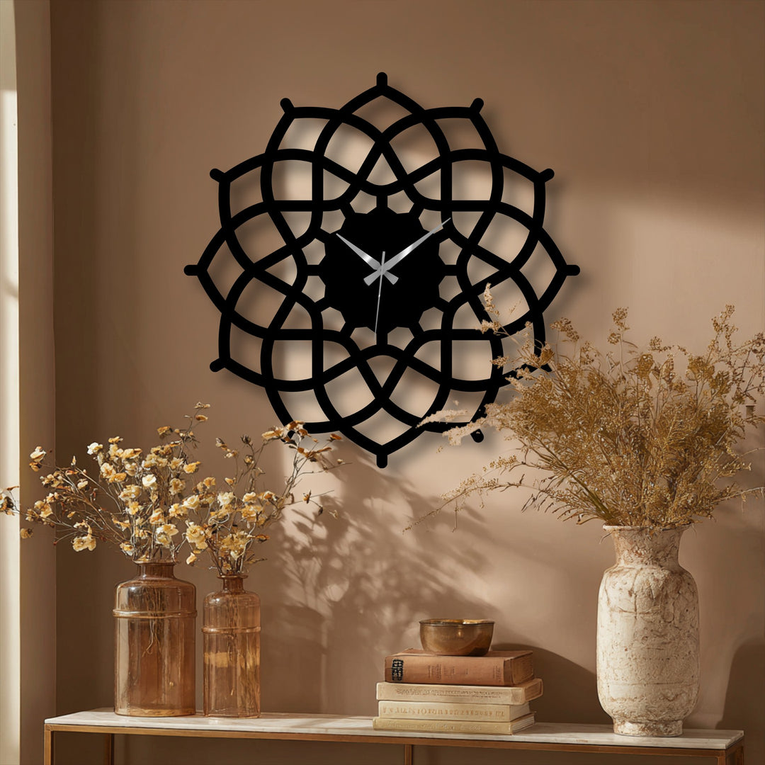 The precise geometric details of this decorative metal art capture the symmetrical abstract design of a mandala wall clock.