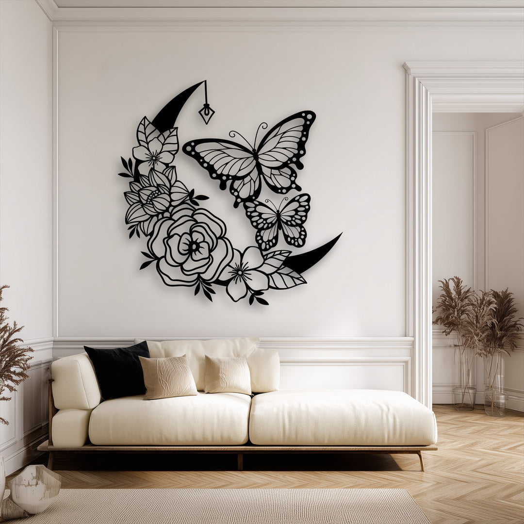 Organic forms of intricate flowers and butterflies adorn the crescent moon metal artwork, creating a captivating wall art design.