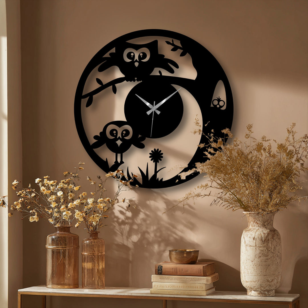 Strong color contrast defines this owl-themed metal artwork clock, a playful and stylish addition with gold hands against a dark, nature-inspired design.