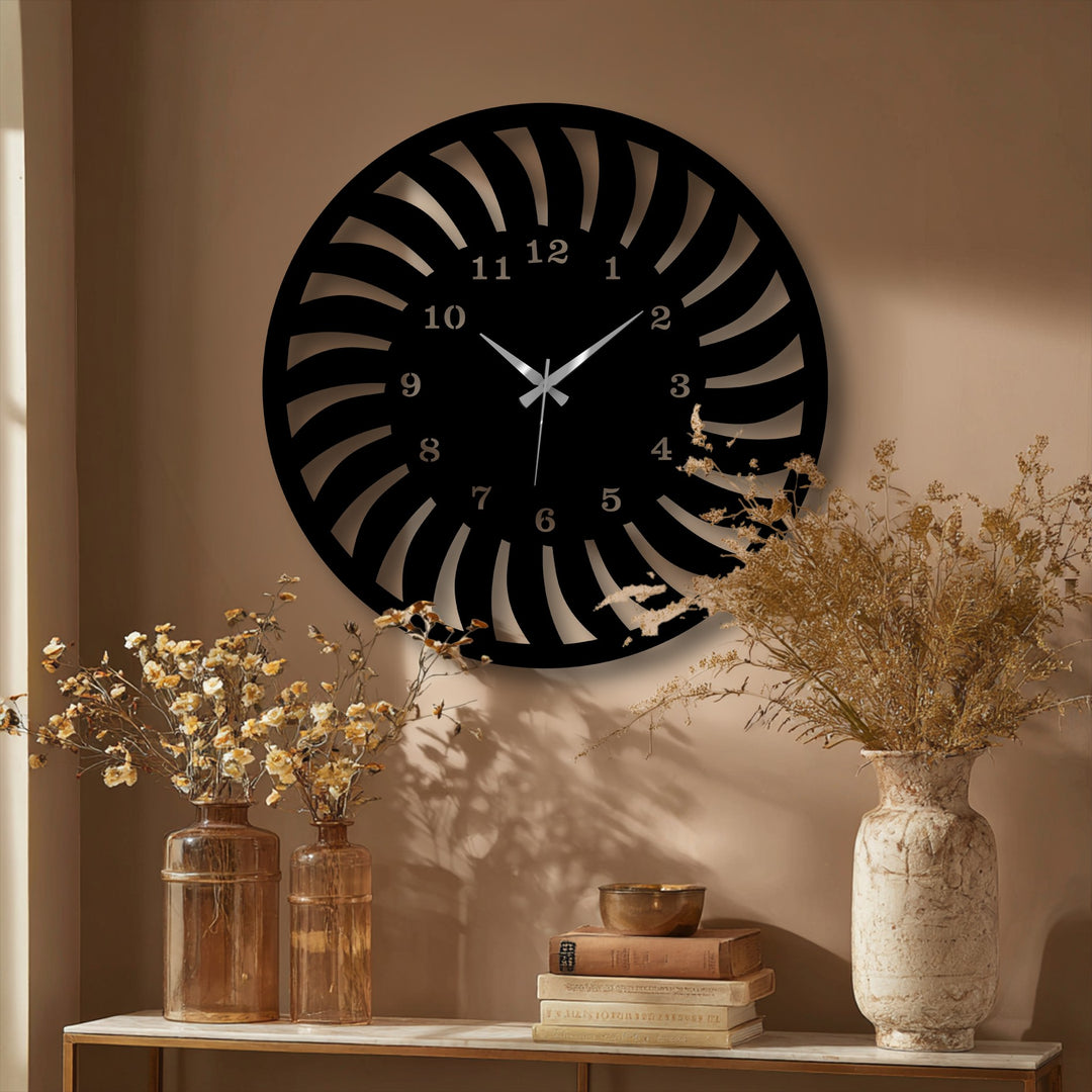 Negative space cleverly forms the intricate radial spiral design of this unique metal wall art, a captivating modern wall clock.