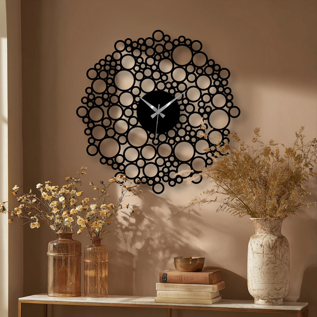 The interconnected organic forms of the bubble mesh metal artwork create a captivating home decoration within this modern geometric wall clock design.