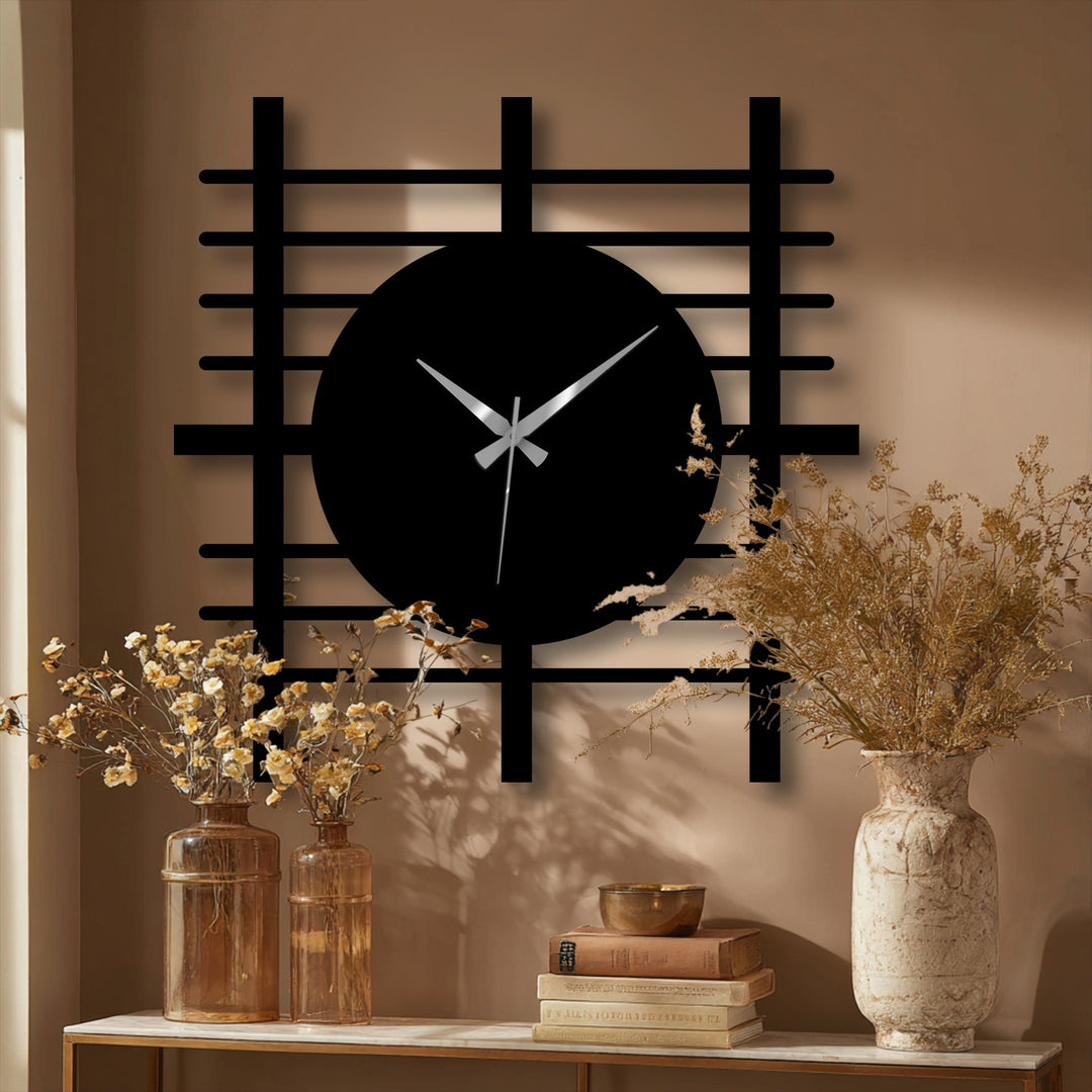 Showing depth and layers, this modern grid panel metal wall clock features an open design, creating a striking piece of metal wall decor.