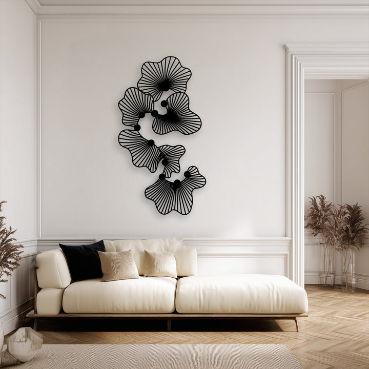 The darkest area showcases intricate black abstract floral metal art for wall, featuring modern line flower designs.