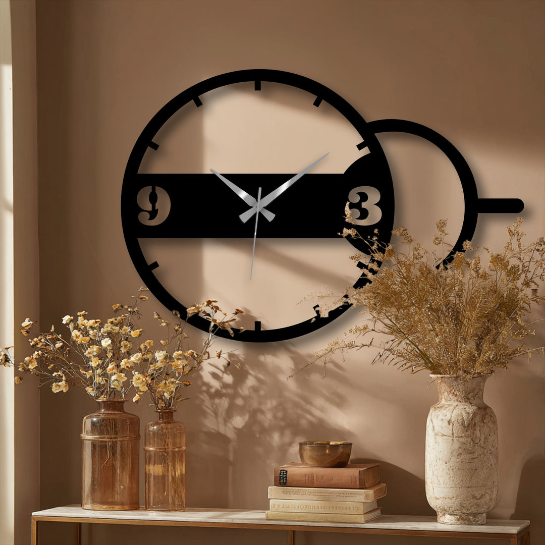 Sweeping silver hands create a sense of movement within this modern geometric dual circle metal clock, a sleek example of metal art for wall.