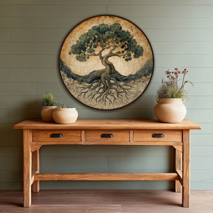 Olive green hues dominate this oil painting art piece, showing an ancient tree of life with intricately detailed roots in a round, symbolic composition.