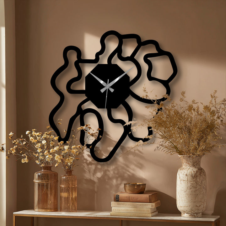 Playing with light and shadow, the modern abstract organic shape metal wall decor clock casts artistic shadows, highlighting its intricate design and enhancing a stylish room.