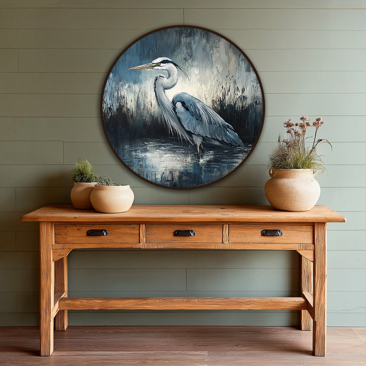 Visible brushstrokes add a textured surface to this oil painting artwork of a heron in a watery landscape, enhancing the elegant, moody feel.