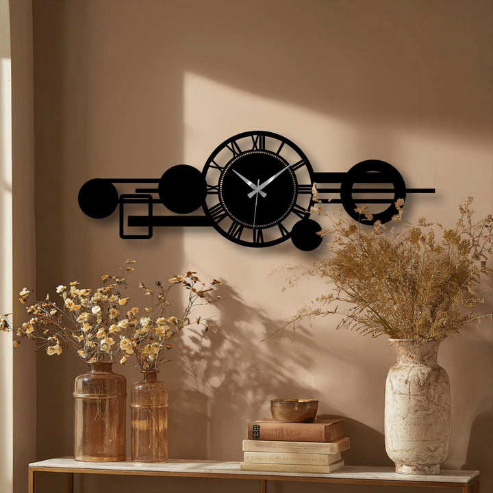 Beige background showcases a modern Roman orbit metal wall clock as decorative wall art, featuring a striking black geometric design with Roman numerals.
