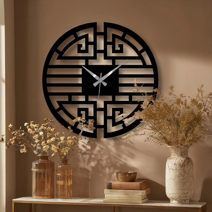 Showcasing its abstract quality, the unique metal wall art of this Asian geometric wall clock creates a modern and oriental decorative statement.
