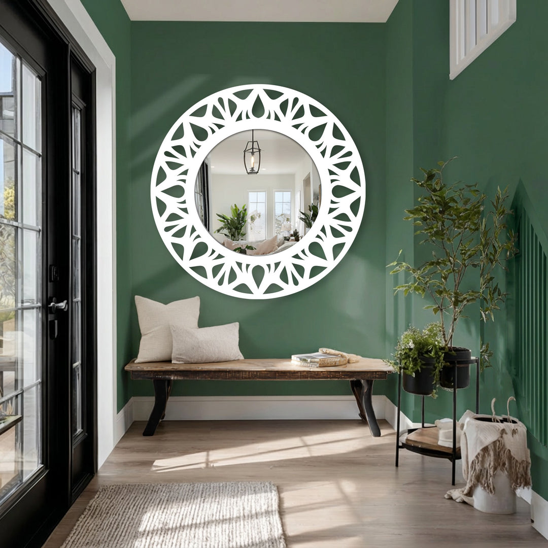 White on green highlights the striking color contrast in this mirror for wall decor, emphasizing the floral cutout design of the modern round floor mirror.