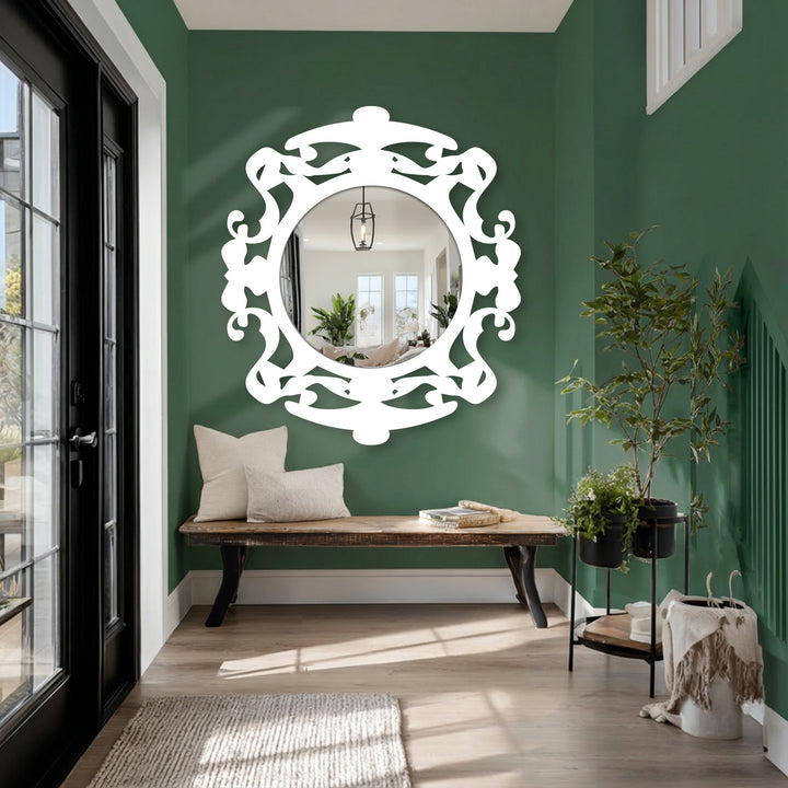 The mirror's finish highlights the ornate decorative mirror frame and the reflected foyer, creating a bright and inviting space.