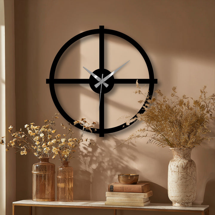 This minimalist black cross metal wall clock is the central subject, offering a modern decorative look and serving as stylish metal artwork for home decoration.