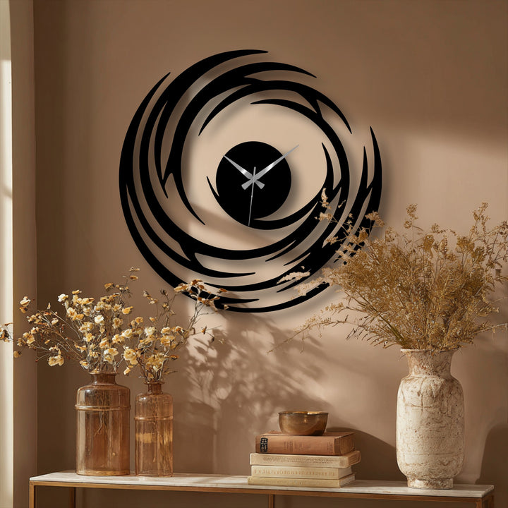 Warm color temperature enhances the golden undertones in this decorative metal art spiral wall clock, a modern swirl design bringing unique modern wall decor to any room.