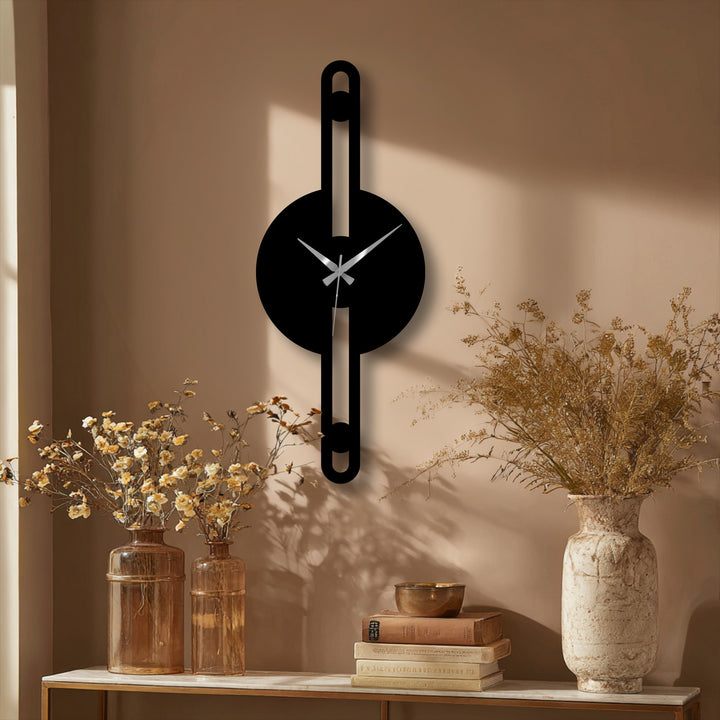 Focusing on the finish, the minimalist vertical line metal wall clock offers a striking modern decoration wall art piece with a sleek and refined texture.