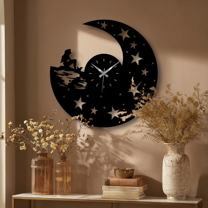 Geometric decoration wall art defines this celestial night design of a moon metal wall clock, cut with precision stars and a mermaid silhouette.