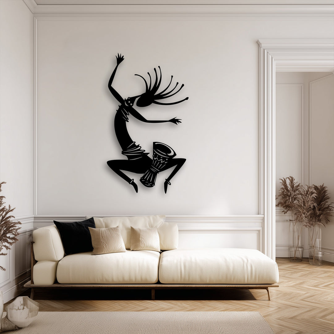 The sense of movement is powerfully conveyed by the energetic, leaping tribal dancer silhouette in this unique metal wall art.