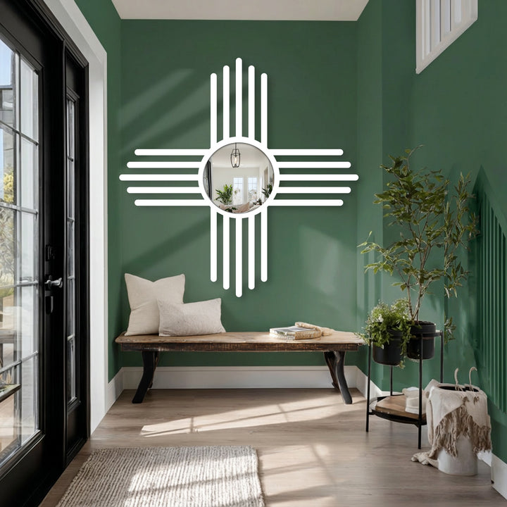Reflecting an interior space, the round modern mirror is the focal point, surrounded by a white cross line design that draws the eye.