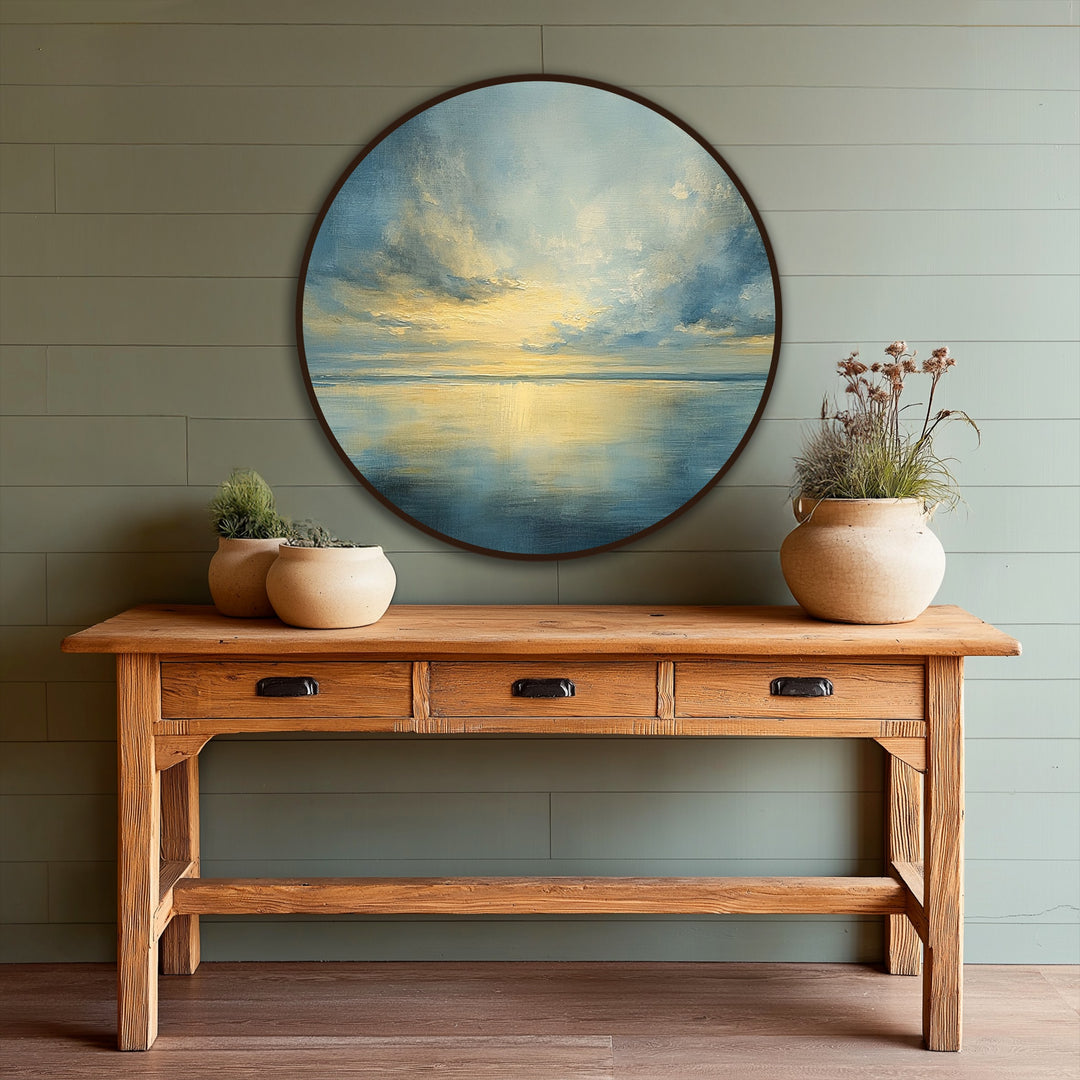Highlighted by its dramatic circular frame, this oil painting reproduction print of a serene sea horizon captures golden light reflecting on still waters.