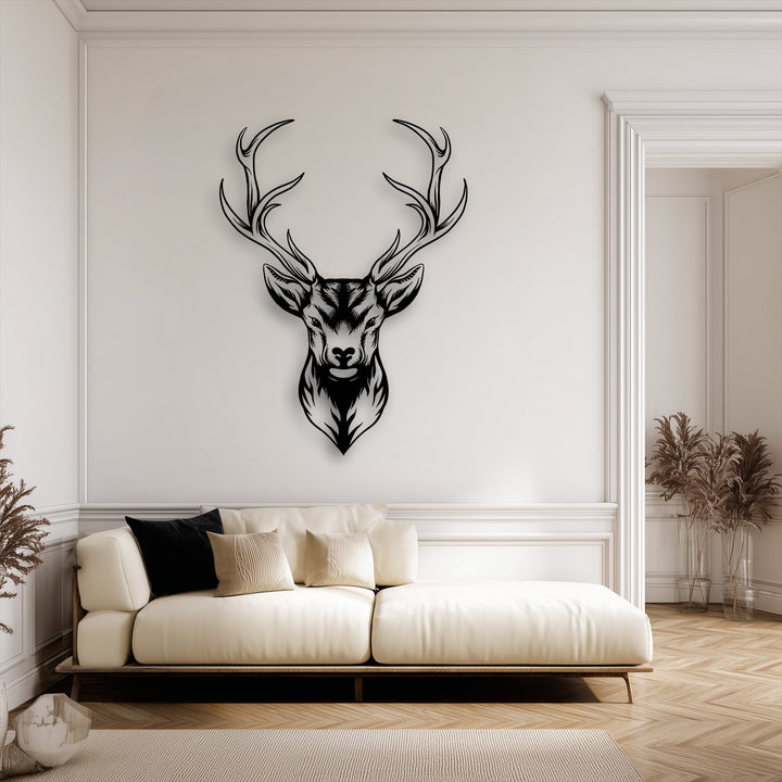 The stillness of the contemporary living space is enhanced by the striking Majestic Deer Head metal wall decor featuring intricate antlers.