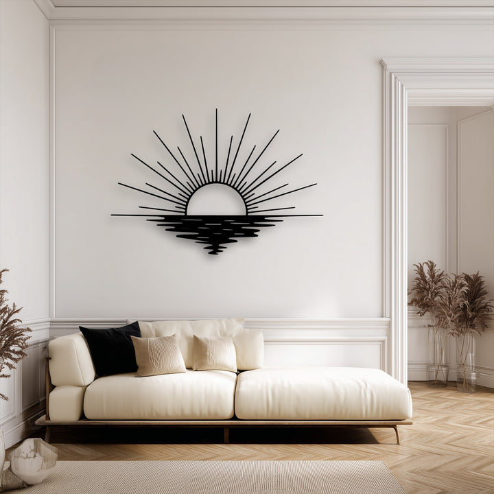 The sun rays and their rippling reflection in this decorative metal art piece evoke the dynamic motion of a sunset over water.