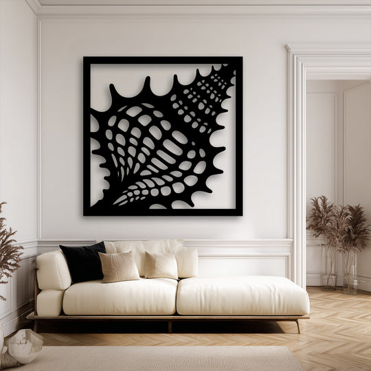 The profound stillness of a contemporary interior is enhanced by the intricate design of the black seashell frame metal wall decor.