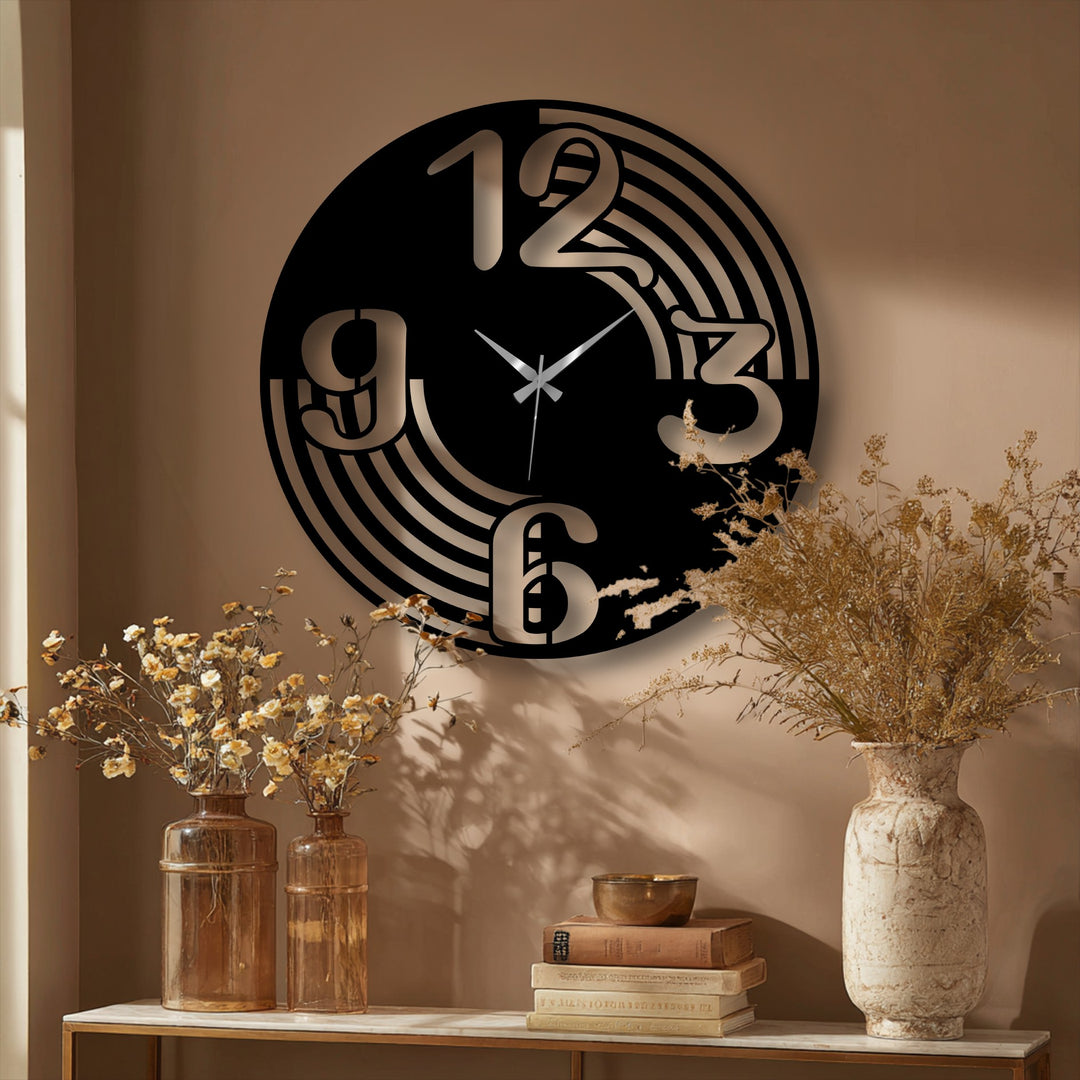 This black decorative metal art wall clock features striking geometric cut-out numbers and elegant flowing curved lines.