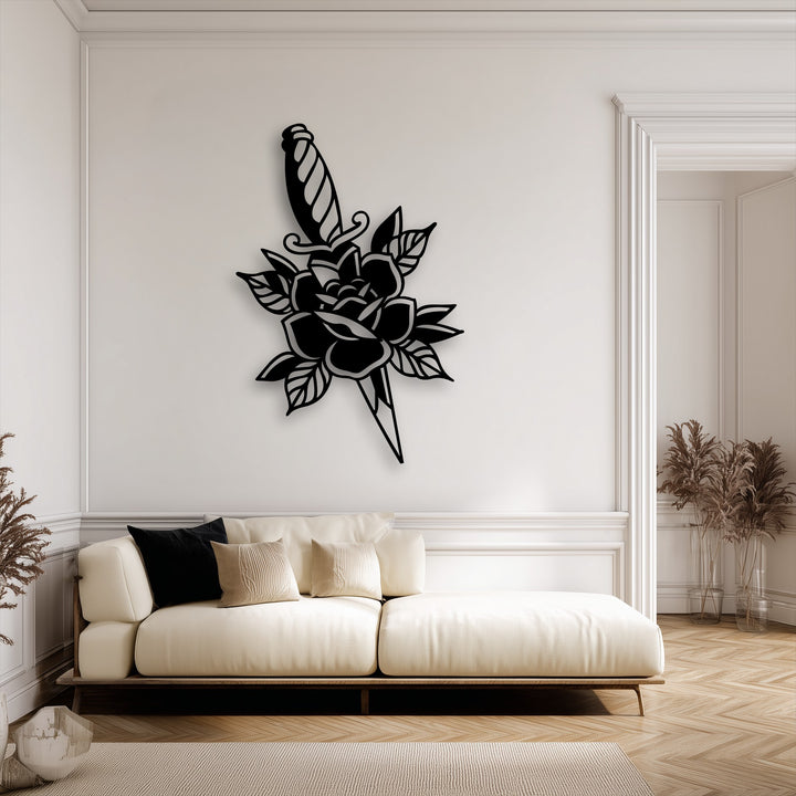 The central subject, a bold rose and dagger decorative metal art silhouette, elegantly enhances a stark white wall.