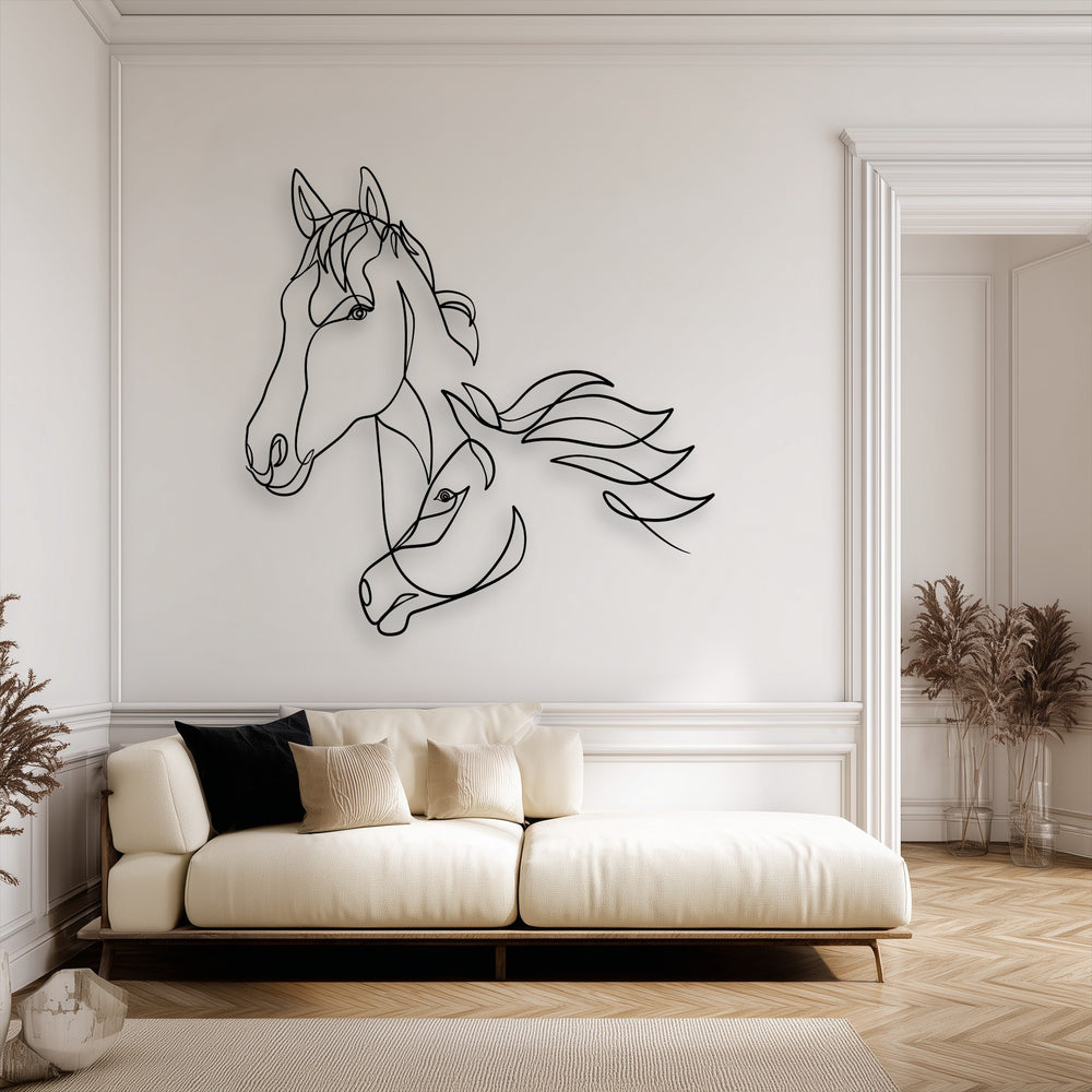 The sleek, smooth surface of the unique metal wall art featuring flowing horse line art creates a minimalist aesthetic on the wall.