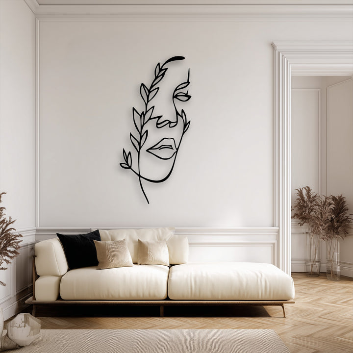 The subdued color saturation highlights the elegant minimalist female line metal art for wall, complementing the neutral room decor.