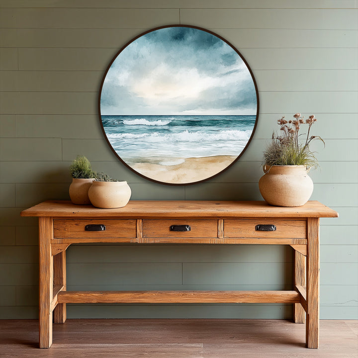Dramatic color contrast highlights the horizon in this coastal scene, a round oil painting decoration showcasing a beach horizon in blue and beige tones.