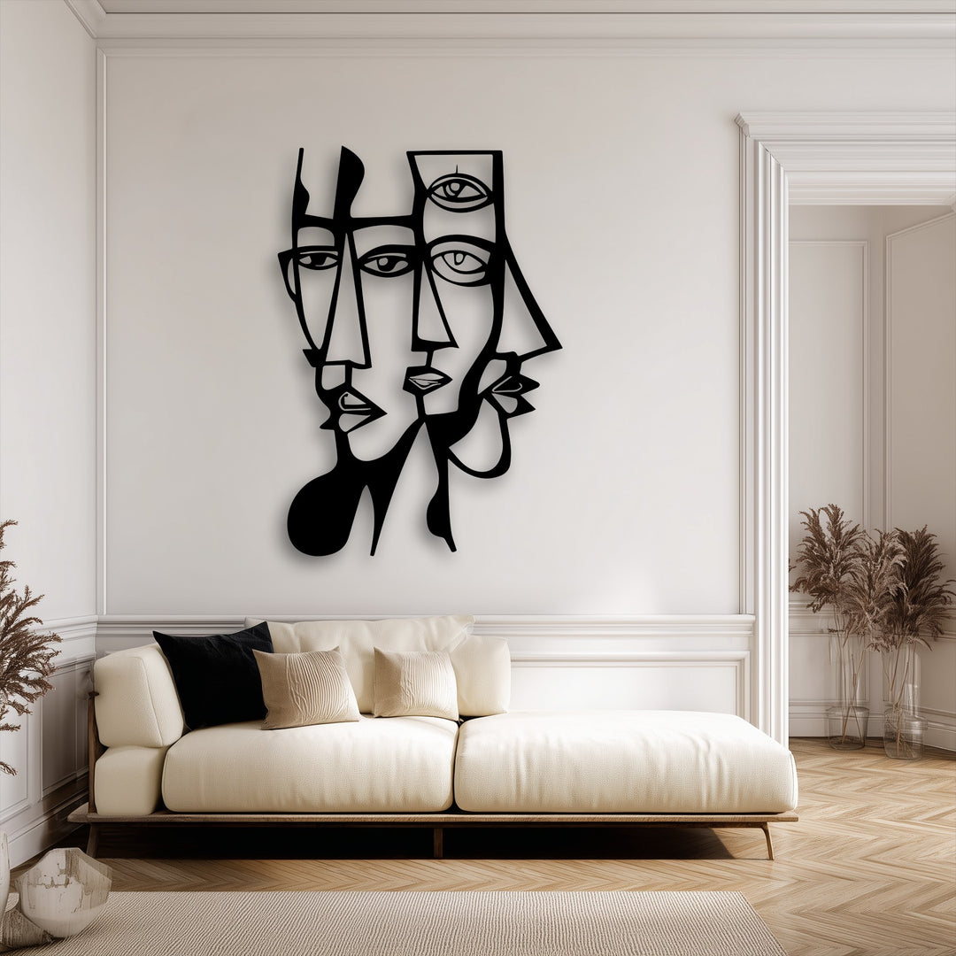 The darkest area showcases a striking unique metal wall art depicting abstract dual faces with geometric lines.