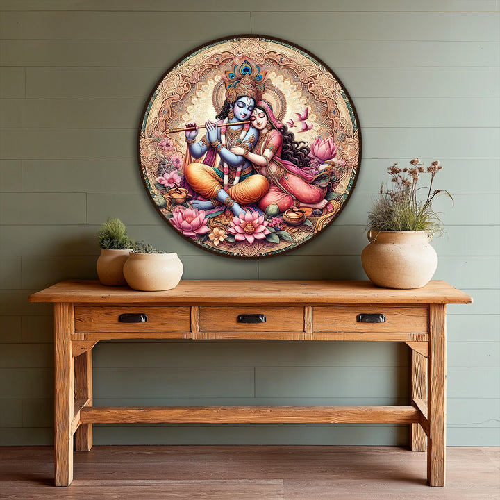Transitional hues blend seamlessly in this round oil painting art piece, depicting Radha and Krishna amidst vibrant lotus flowers and a detailed golden mandala.