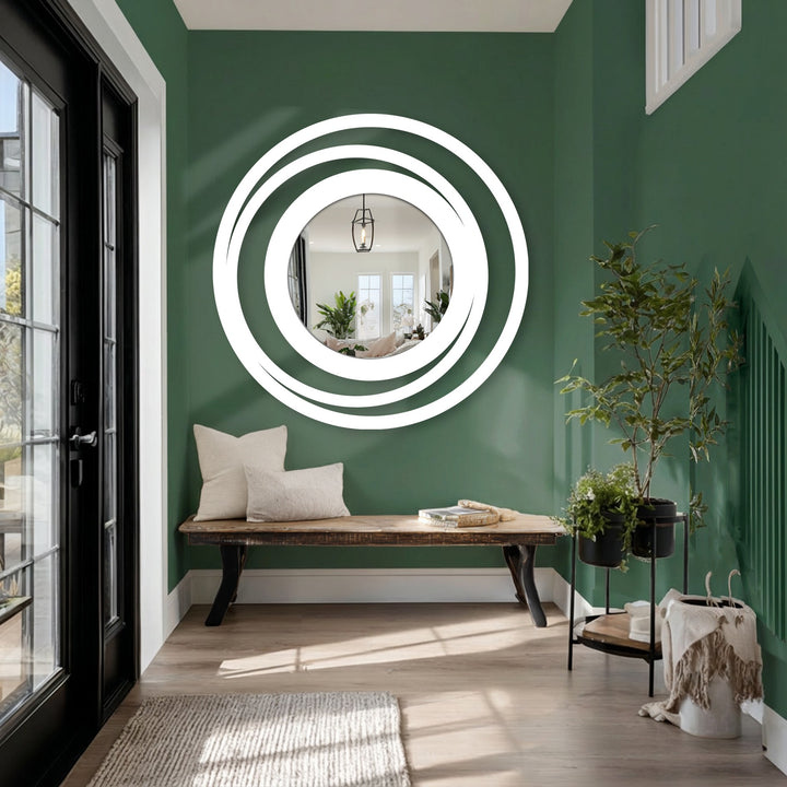 Swirling concentric circles of the Orbit Ring Floor Mirror's design create a compelling sense of movement for eye-catching decorative metal art.