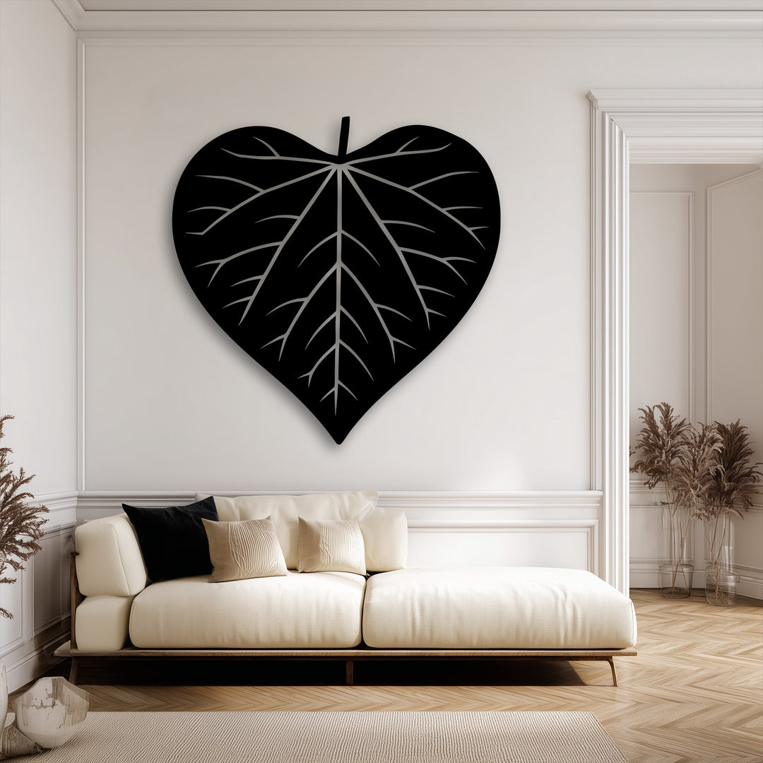 Capturing organic movement, the bold veins of the Nature Heart leaf silhouette decorative metal art elegantly expand across the wall.
