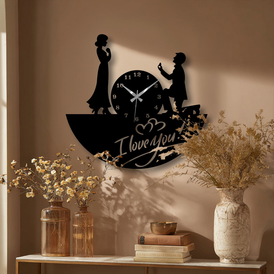 Warm color temperature highlights the decorative metal art of the Love Proposal Wall Clock, depicting a romantic silhouette couple design.