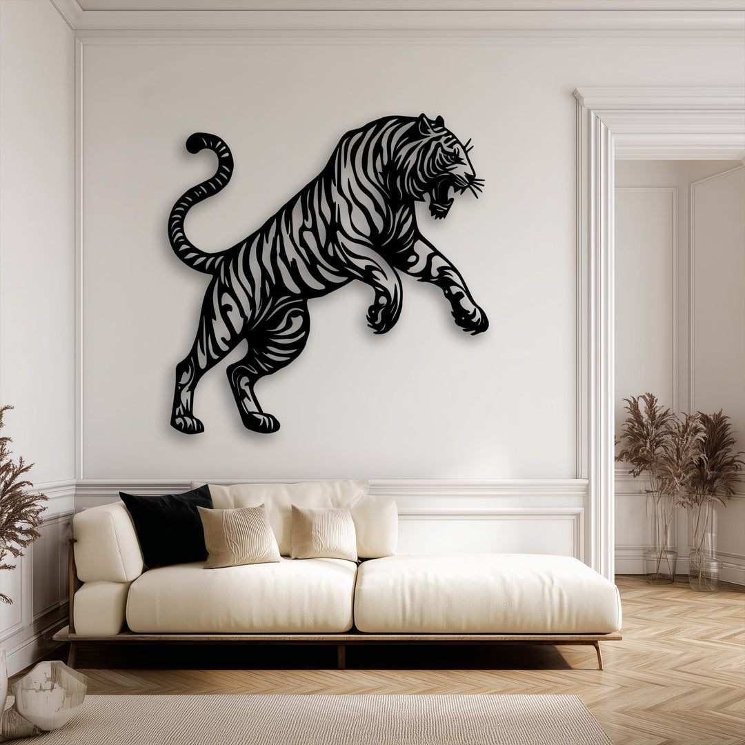 A striking black tiger silhouette metal artwork leaps with powerful movement above a sofa, conveying dynamic energy.