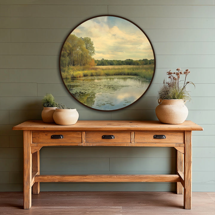 Capturing the focal point, this golden meadow reflection presents a round tranquil landscape with lily pads, a striking example of oil painting wall art perfect for peaceful interiors.