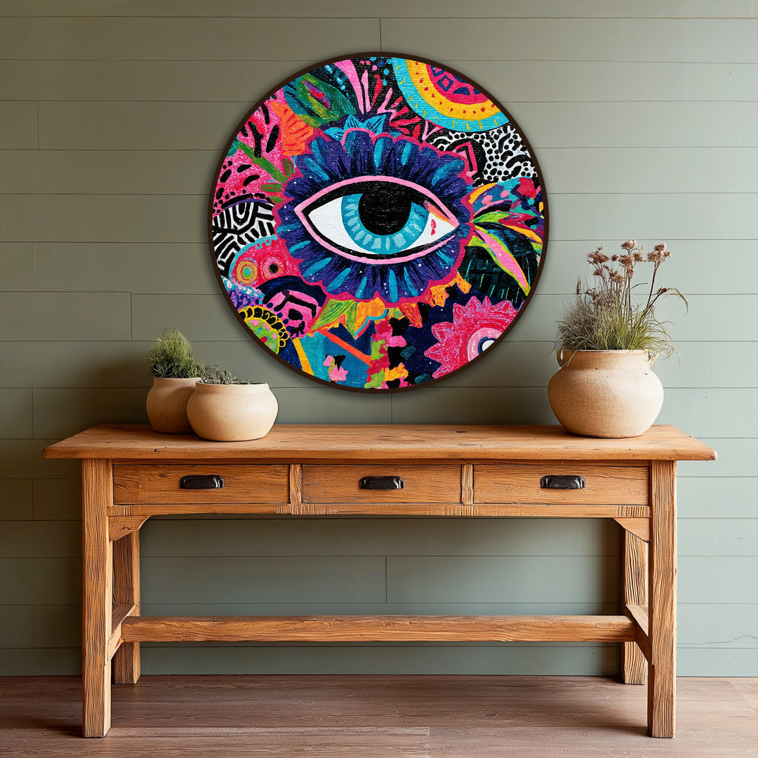 Dominant with a spectrum of colors, this round abstract oil painting art piece showcases a vivid mystic eye surrounded by lively patterns, creating a striking visual.